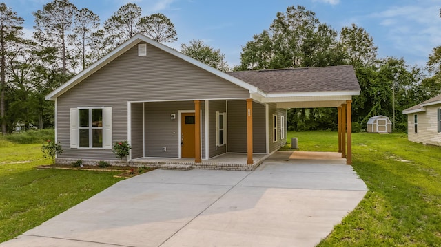 306 S Magnolia Ave, Andrews, SC 29510 - view of front of house with covered porch, a front yard, roof with shingles, and driveway