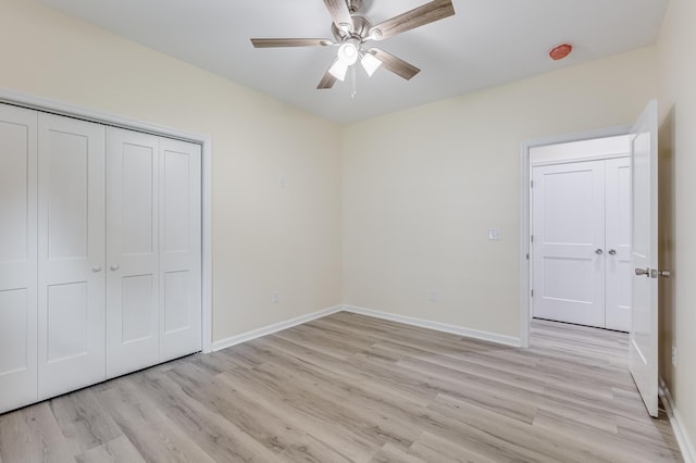 306 S Magnolia Ave, Andrews, SC 29510 - unfurnished bedroom featuring light wood-type flooring, baseboards, a closet, and a ceiling fan
