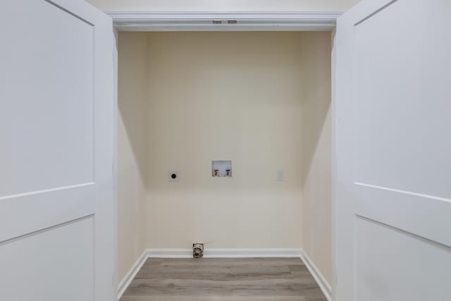 306 S Magnolia Ave, Andrews, SC 29510 - laundry room with hookup for an electric dryer, washer hookup, wood finished floors, and baseboards