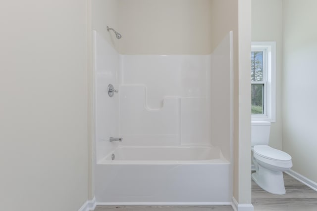 306 S Magnolia Ave, Andrews, SC 29510 - full bathroom featuring baseboards, toilet, wood finished floors, and shower / bath combination