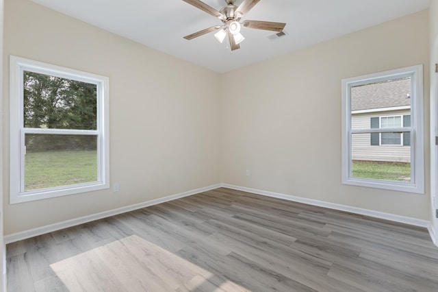 306 S Magnolia Ave, Andrews, SC 29510 - unfurnished room with wood finished floors, ceiling fan, and baseboards