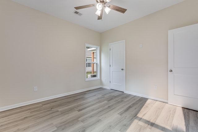 306 S Magnolia Ave, Andrews, SC 29510 - unfurnished bedroom featuring light wood finished floors, baseboards, and ceiling fan