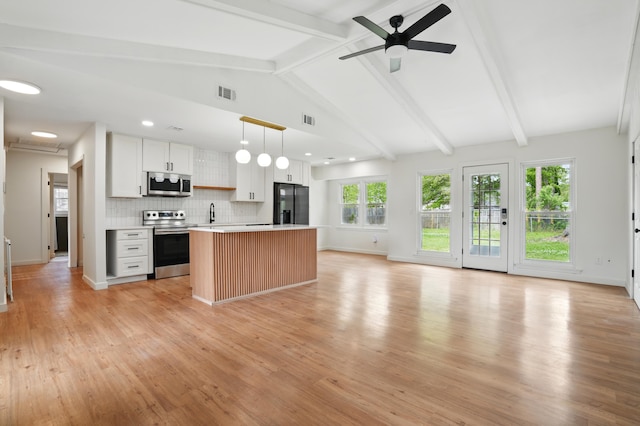 106 Ruffin Rd, Summerville, SC 29486 - kitchen with visible vents, appliances with stainless steel finishes, light countertops, open floor plan, and backsplash