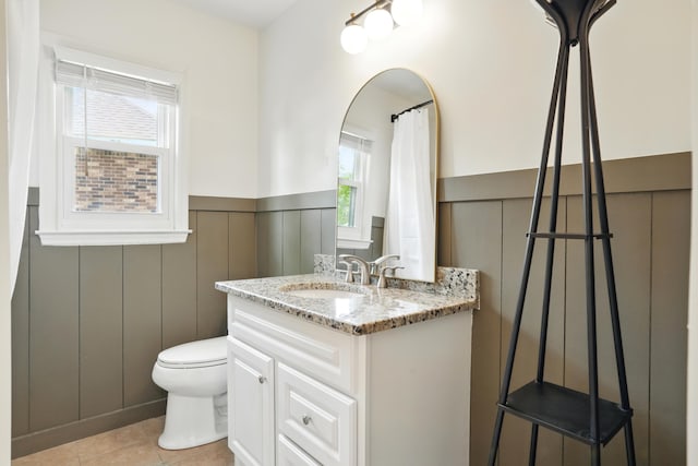 106 Ruffin Rd, Summerville, SC 29486 - bathroom featuring toilet, tile patterned floors, a wainscoted wall, and vanity