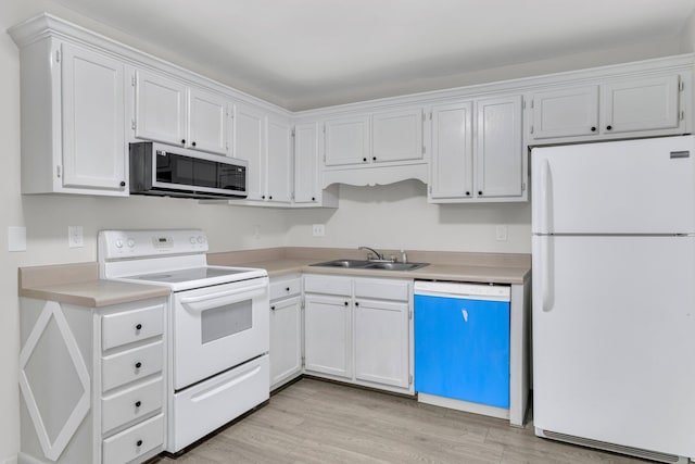 kitchen featuring white cabinetry, white appliances, sink, and light hardwood / wood-style flooring