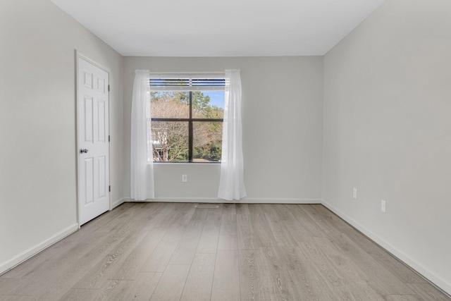 empty room featuring light hardwood / wood-style floors