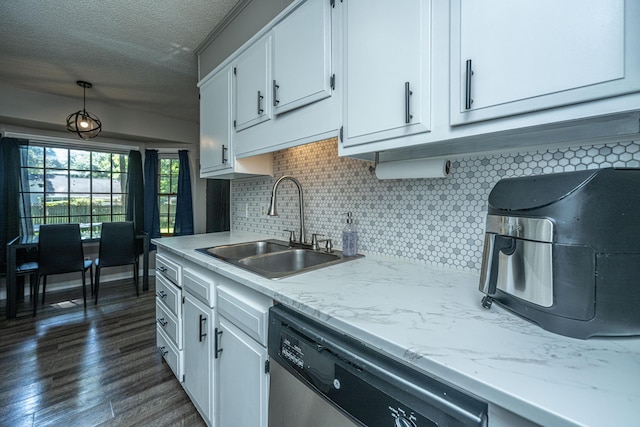 kitchen featuring white cabinets, stainless steel dishwasher, dark wood-type flooring, and sink