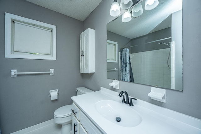 bathroom with tile patterned floors, a shower with curtain, vanity, a textured ceiling, and toilet