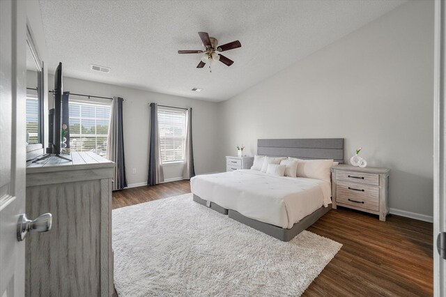 1219 Bradley Blvd, Summerville, SC 29486 - bedroom featuring dark wood-style flooring, baseboards, a textured ceiling, and a ceiling fan