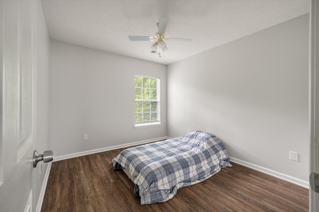 1219 Bradley Blvd, Summerville, SC 29486 - bedroom with wood finished floors, baseboards, a textured ceiling, and ceiling fan