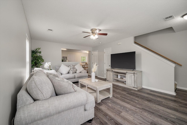 1219 Bradley Blvd, Summerville, SC 29486 - living area with a ceiling fan, dark wood-style flooring, baseboards, and healthy amount of natural light
