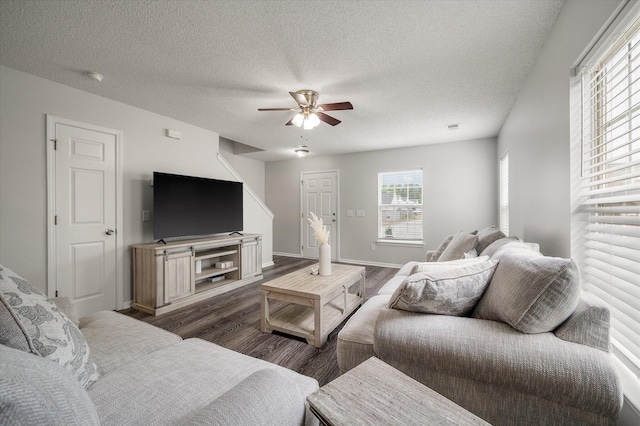 1219 Bradley Blvd, Summerville, SC 29486 - living area featuring wood finished floors, a ceiling fan, a textured ceiling, and baseboards