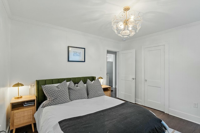 bedroom featuring dark wood-type flooring, crown molding, and a notable chandelier