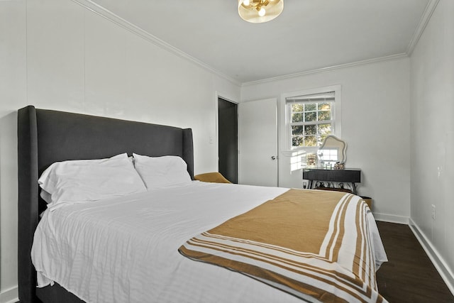 bedroom featuring dark wood-type flooring and crown molding