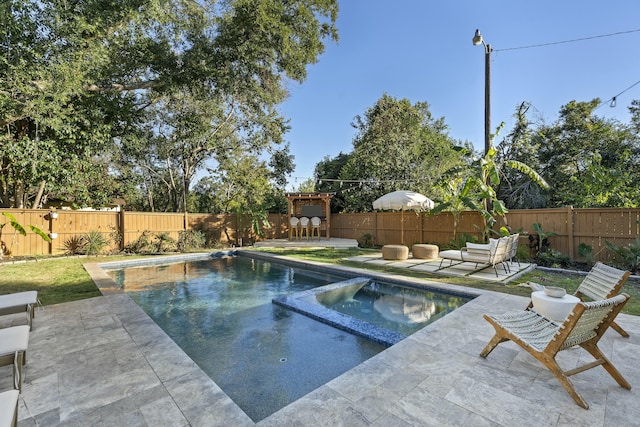 view of swimming pool with outdoor lounge area, an in ground hot tub, and a patio