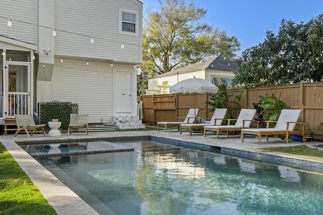 view of pool featuring a patio