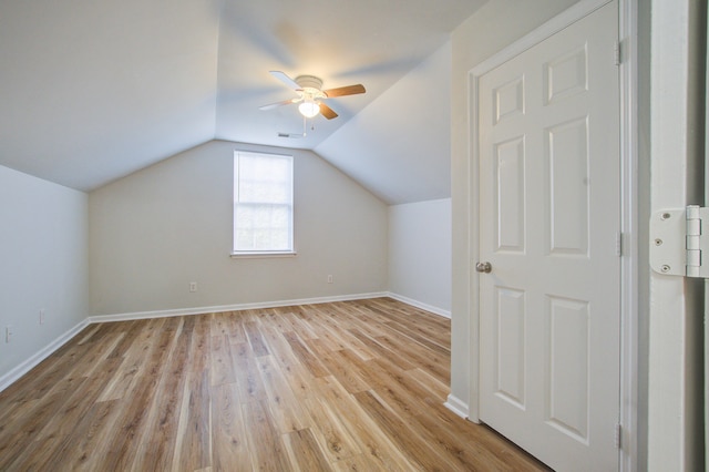 bonus room with ceiling fan, light wood-type flooring, and vaulted ceiling