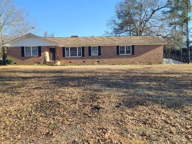 ranch-style house featuring crawl space and brick siding