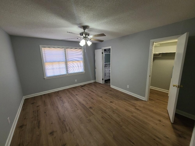 unfurnished bedroom with wood finished floors and baseboards