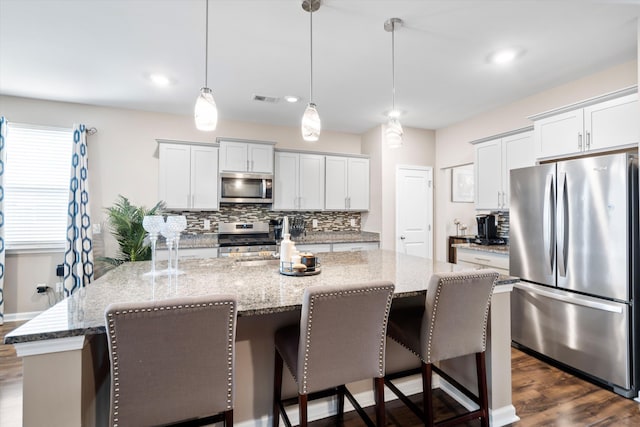 413 Ribiero Dr, Summerville, SC 29486 - kitchen featuring tasteful backsplash, a center island, visible vents, and appliances with stainless steel finishes