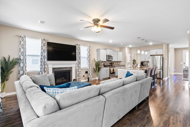 413 Ribiero Dr, Summerville, SC 29486 - living room with baseboards, ceiling fan, visible vents, and dark wood-style flooring