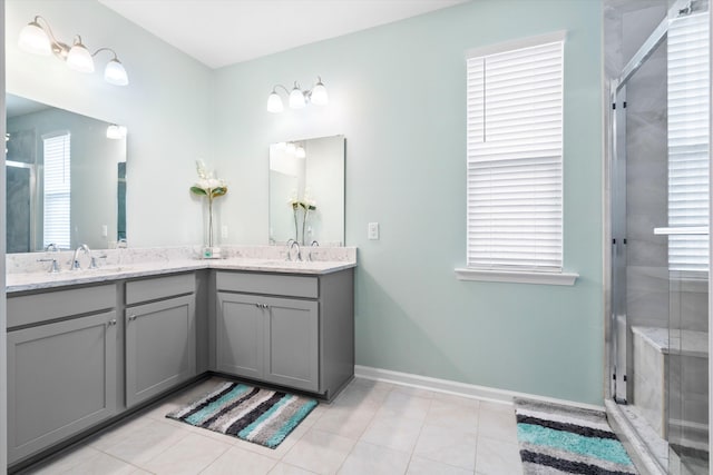 413 Ribiero Dr, Summerville, SC 29486 - bathroom featuring a sink, double vanity, baseboards, and a shower stall