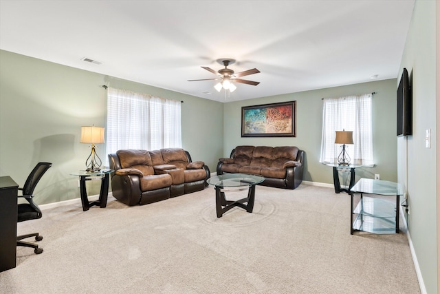 413 Ribiero Dr, Summerville, SC 29486 - carpeted living room with baseboards, a healthy amount of sunlight, and a ceiling fan