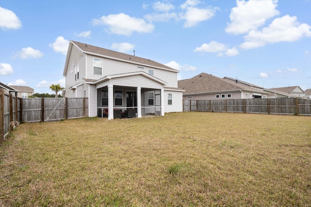 413 Ribiero Dr, Summerville, SC 29486 - rear view of house with a fenced backyard, a sunroom, and a lawn