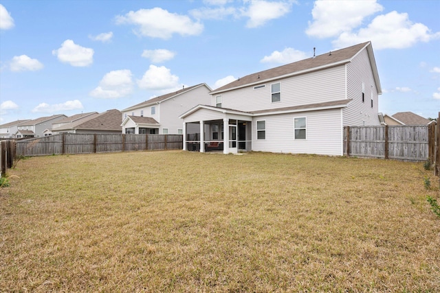 413 Ribiero Dr, Summerville, SC 29486 - back of house featuring a lawn, a sunroom, and a fenced backyard