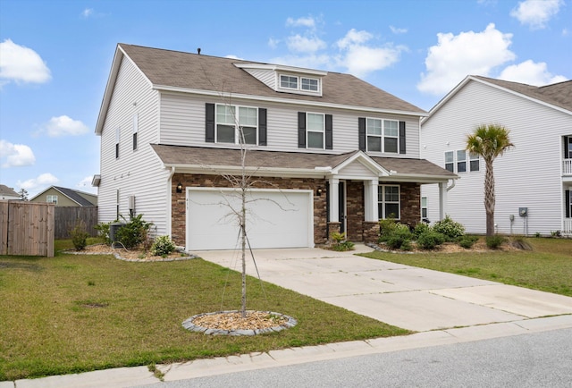 413 Ribiero Dr, Summerville, SC 29486 - view of front facade with stone siding, a garage, fence, concrete driveway, and a front lawn