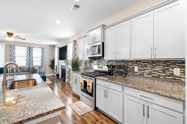 413 Ribiero Dr, Summerville, SC 29486 - kitchen with a sink, tasteful backsplash, visible vents, a ceiling fan, and appliances with stainless steel finishes