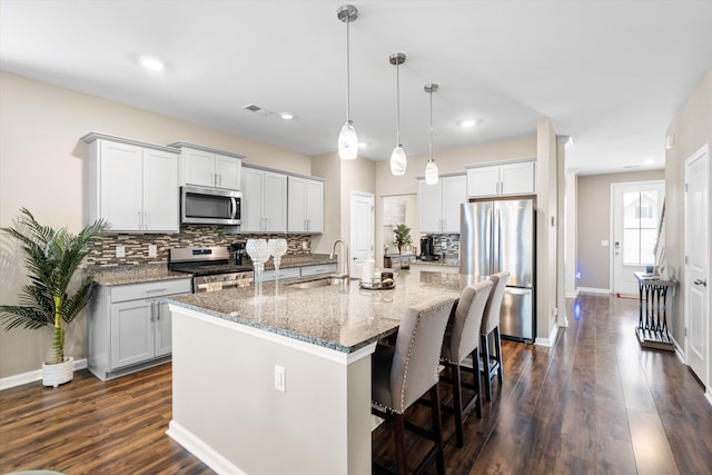 413 Ribiero Dr, Summerville, SC 29486 - kitchen featuring visible vents, a sink, a center island with sink, tasteful backsplash, and appliances with stainless steel finishes