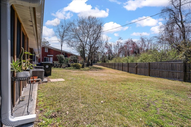 view of yard featuring cooling unit and a fenced backyard