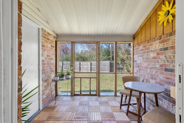 sunroom featuring wooden ceiling