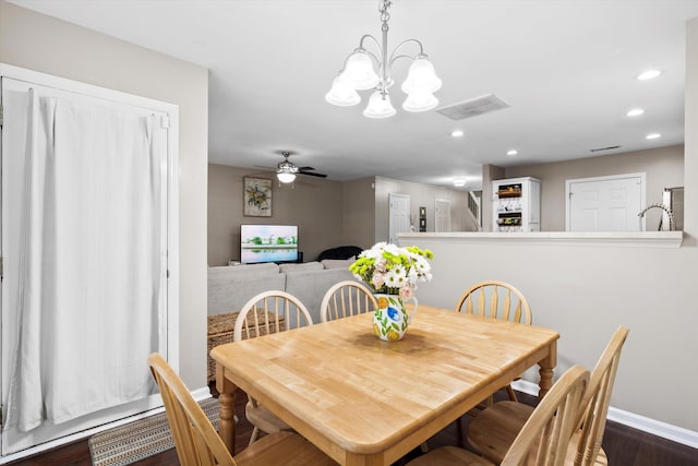 8676 Grassy Oak Trl, North Charleston, SC 29420 - dining room with recessed lighting, baseboards, a chandelier, dark wood-type flooring, and ceiling fan