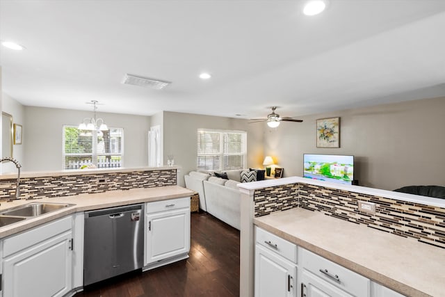 8676 Grassy Oak Trl, North Charleston, SC 29420 - kitchen with stainless steel dishwasher, a sink, tasteful backsplash, dark wood-style flooring, and recessed lighting
