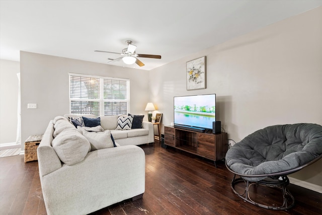 8676 Grassy Oak Trl, North Charleston, SC 29420 - living room featuring dark wood-style flooring, a ceiling fan, and baseboards