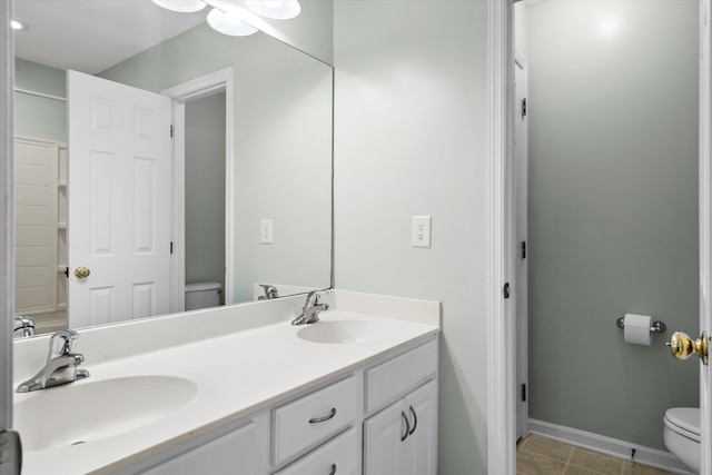 8676 Grassy Oak Trl, North Charleston, SC 29420 - full bath featuring toilet, baseboards, double vanity, and tile patterned floors