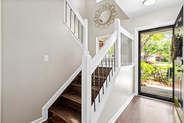 8676 Grassy Oak Trl, North Charleston, SC 29420 - entryway with stairs, wood finished floors, and baseboards