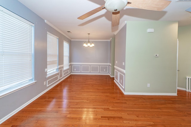 unfurnished room with crown molding, hardwood / wood-style floors, and ceiling fan with notable chandelier