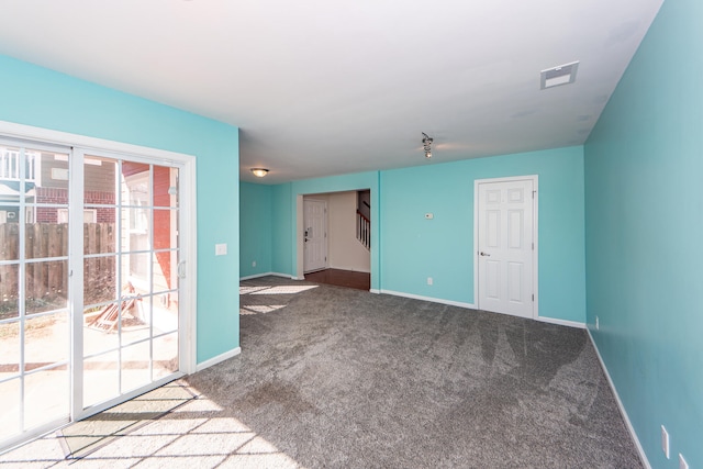 empty room featuring carpet flooring