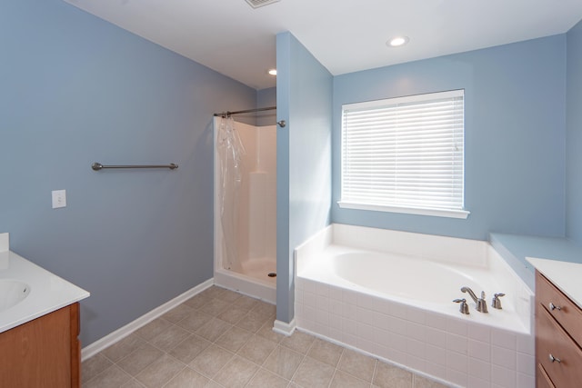 bathroom featuring tile patterned floors, vanity, and independent shower and bath