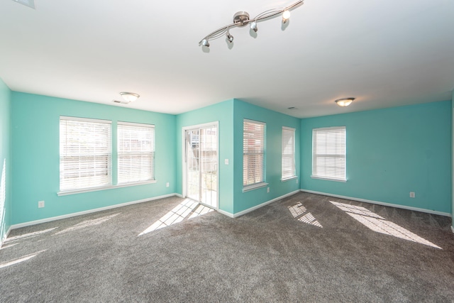 unfurnished living room featuring carpet floors