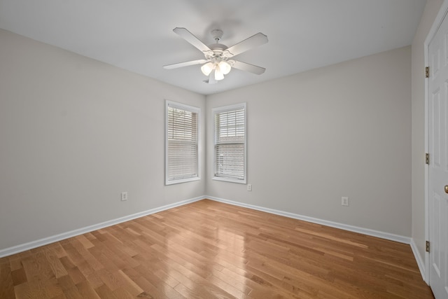 unfurnished room with light wood-style flooring, baseboards, and ceiling fan