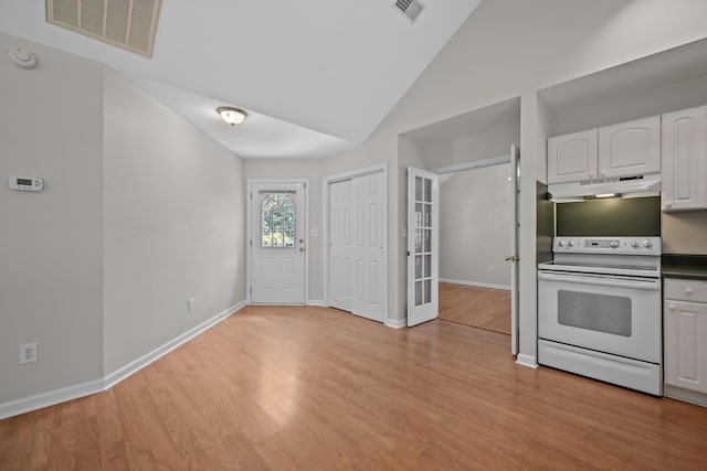 kitchen with white range with electric cooktop, under cabinet range hood, white cabinets, light wood-type flooring, and high vaulted ceiling