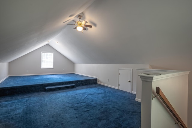 additional living space with lofted ceiling, carpet, ceiling fan, and baseboards