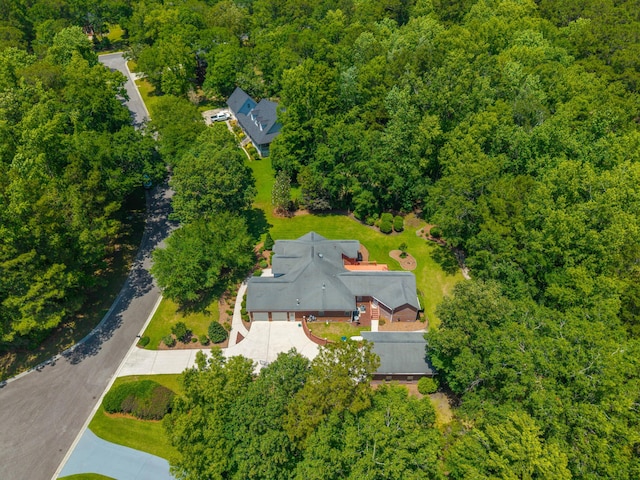 drone / aerial view of a heavily wooded area