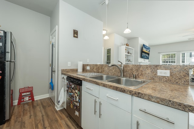 kitchen with decorative light fixtures, appliances with stainless steel finishes, dark hardwood / wood-style flooring, white cabinetry, and sink