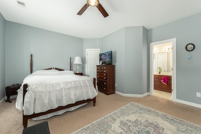 bedroom featuring light colored carpet, connected bathroom, and ceiling fan