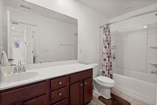 full bathroom featuring tile patterned flooring, vanity, shower / tub combo with curtain, and toilet